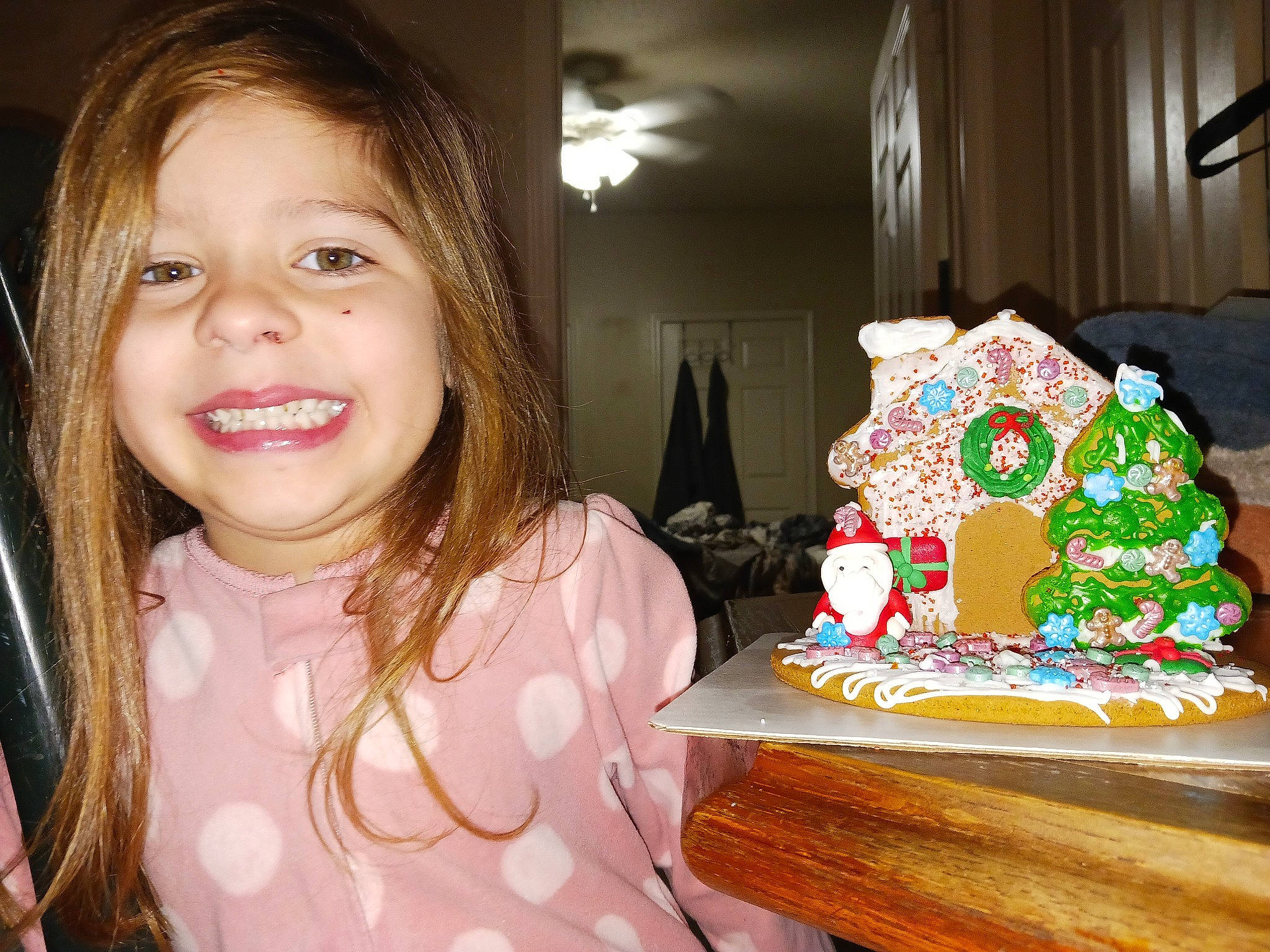 Nova is registered to the contest to win money with this photo: baked_goods, baking, buttercream, cake, cake_decorating, christmas, dessert, event, eyelash, fun, gingerbread_house, happy, icing, joy, party, person, plate, smile, sugar_cake, sugar_paste