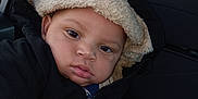 Ja'Karta is registered to the contest to win money with this photo: baby, car_interior, car_seat, casual, child, coat, curious, cute, expression, face, hooded_jacket, indoors, person, portrait, seat, toddler, warm_clothing, window, winter_wear, young_child