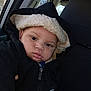 baby, car_interior, car_seat, casual, child, coat, curious, cute, expression, face, hooded_jacket, indoors, person, portrait, seat, toddler, warm_clothing, window, winter_wear, young_child