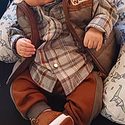 Ja'Karta is registered to the contest to win money with this photo: baby, brown_clothing, casual_clothing, child, closeup, cozy, cute, hat, indoor, infant, origami_dinosaurs, patterned_pillow, peaceful, pillow, plaid_shirt, relaxing, resting, shoes, sleeping, vest