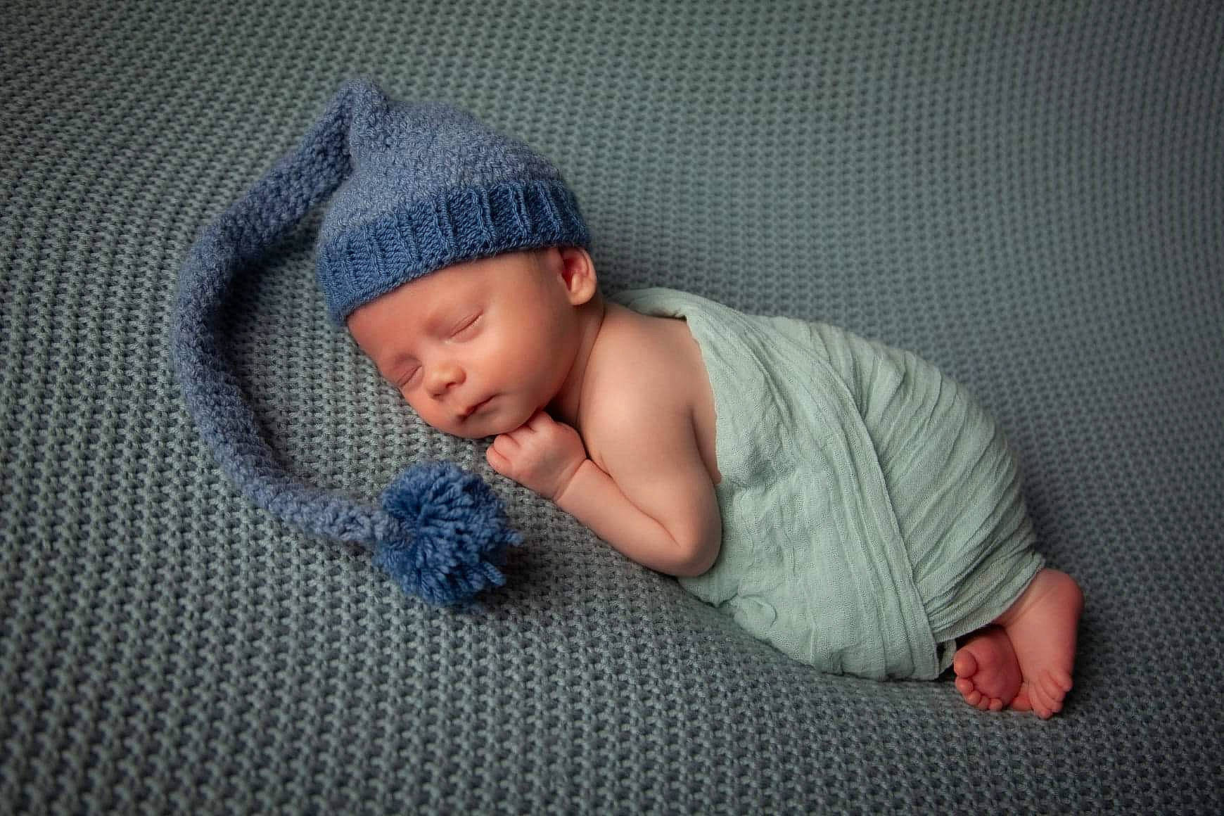 Jaylon is registered to the contest to win money with this photo: baby, baby_sleeping, bonnet, cap, child, hand, headgear, knit_cap, knitting, nap, person, skin, sleep, toddler