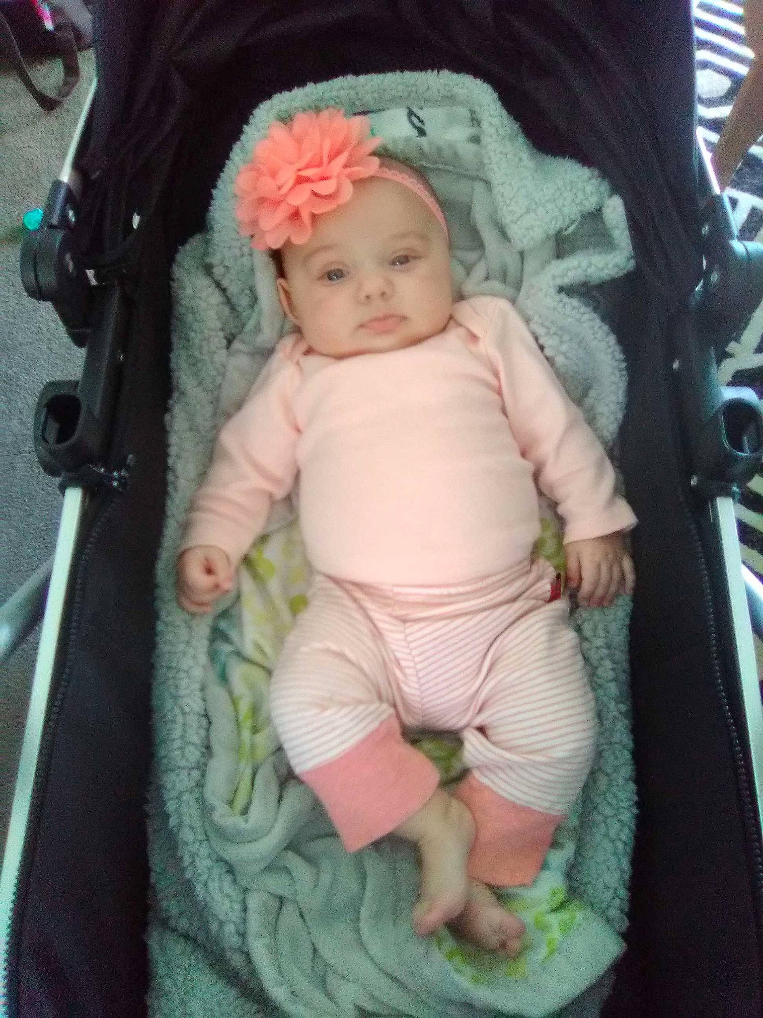 Brighton is registered to the contest to win money with this photo: baby, baby_carriage, baby_products, cheek, child, person, pink, product, swing, toddler