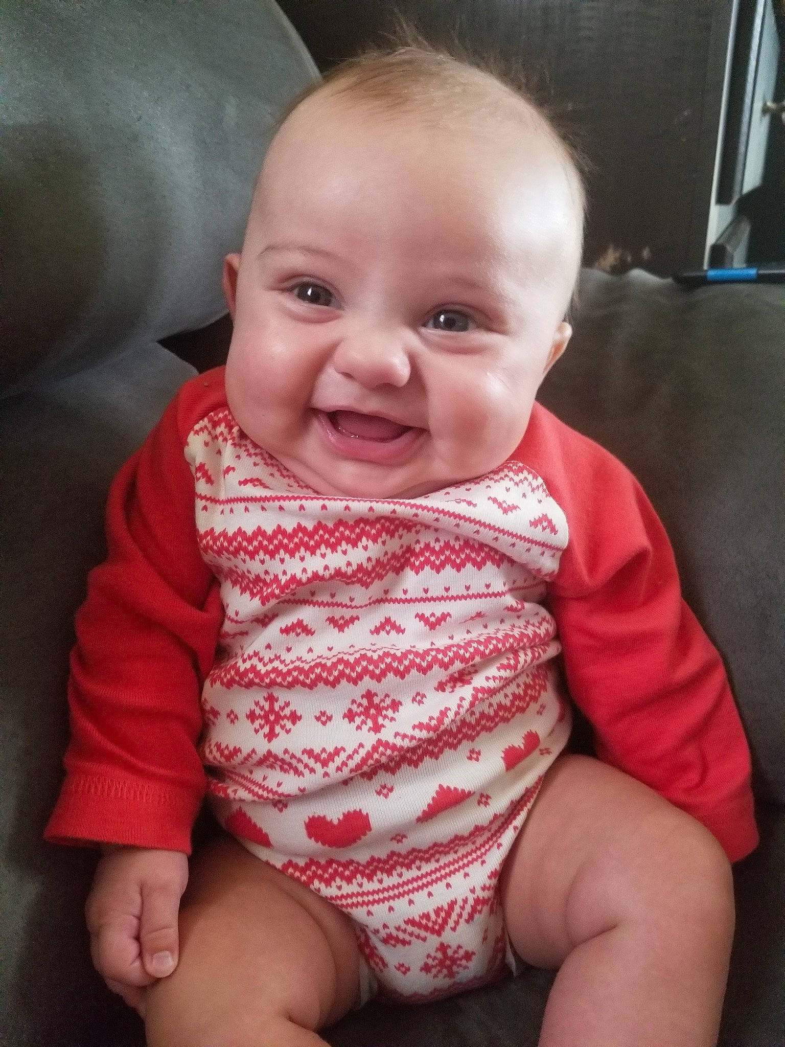 Brighton is registered to the contest to win money with this photo: baby, beauty, cheek, child, chin, eye, face, facial_expression, head, iris, leg, lip, mouth, nose, people, person, pink, sitting, skin, smile