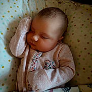 Ember joined the competition — help win amazing prizes! baby, sleeping, infant, pink_clothing, blanket, cushion, polka_dots, face, peaceful, cozy, child, portrait, resting, indoors, cute, newborn, soft_lighting, closeup, baby_bed, patterned_fabric