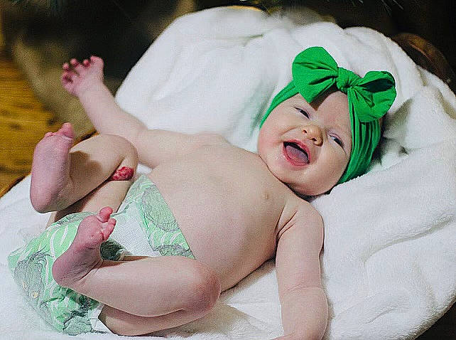 Leighton joined the competition — help win amazing prizes! baby, baby_sleeping, baby_toddler_clothing, child, comfort, event, fashion_accessory, foot, grass, happy, hat, headband, headgear, headwear, human_leg, linens, person, pink, skin, smile