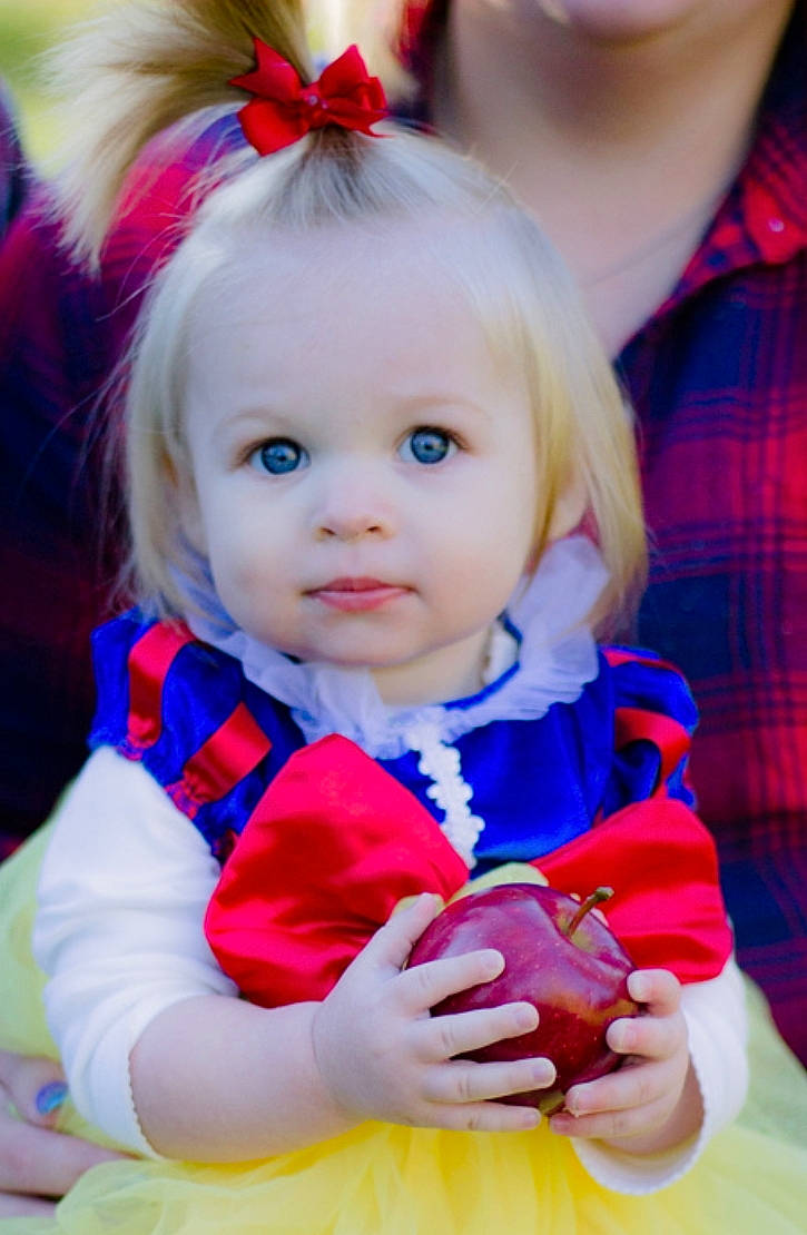 Olivia is registered to the contest to win money with this photo: child, doll, eye, fun, girl, hair, hair_accessory, happiness, human_hair_color, infant, iris, person, pink, play, product, red, skin, smile, toddler, toy