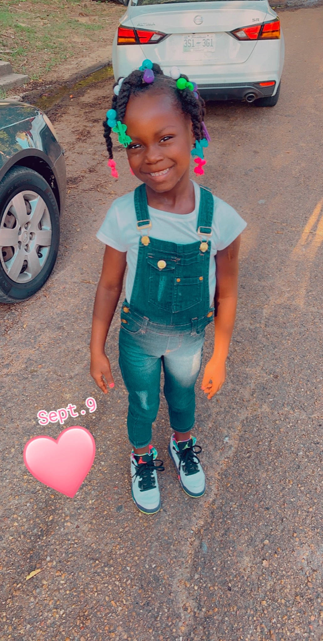 Courtney is registered to the contest to win money with this photo: asphalt, automotive_tire, car, cool, face, facial_expression, fun, hair, happy, head, joy, morning, organ, person, pink, red, smile, summer, tire, vehicle_door