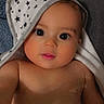 baby, infant, child, portrait, face, eyes, smiling, indoor, towel, hood, stars, bare_shoulders, lying_down, close_up, blanket, soft_lighting, home, cute, photography, adorable