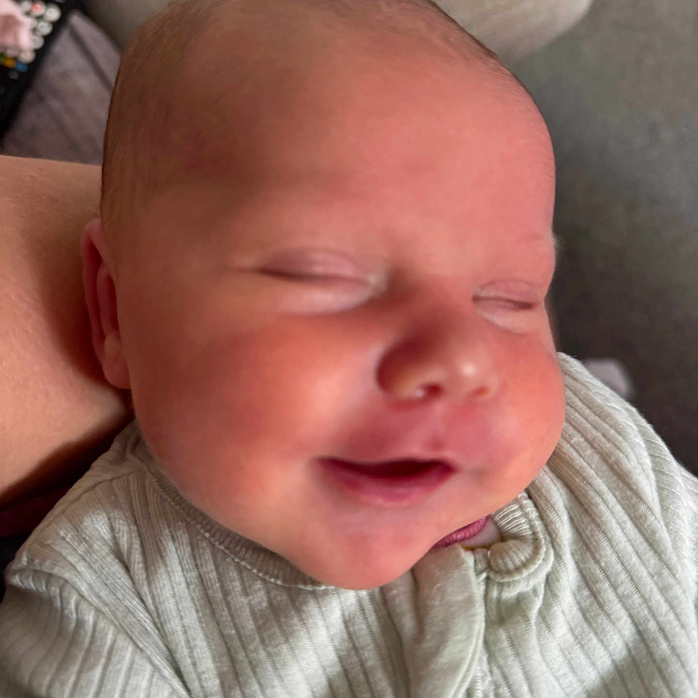 Lily-Anne is registered to the contest to win money with this photo: baby, cheeks, closed_eyes, closeup, clothing, cozy, cute, face, head, human, indoors, infant, newborn, peaceful, person, portrait, ribbed_fabric, skin, sleeping, smiling
