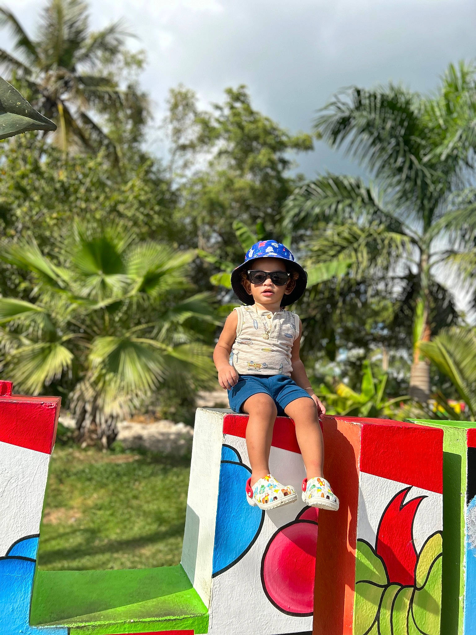 Neymar joined the competition — help win amazing prizes! arecales, cloud, fun, grass, hat, headwear, human_leg, leisure, nature, palm_tree, people_in_nature, person, plant, recreation, sandal, shade, shorts, sky, thigh, toddler