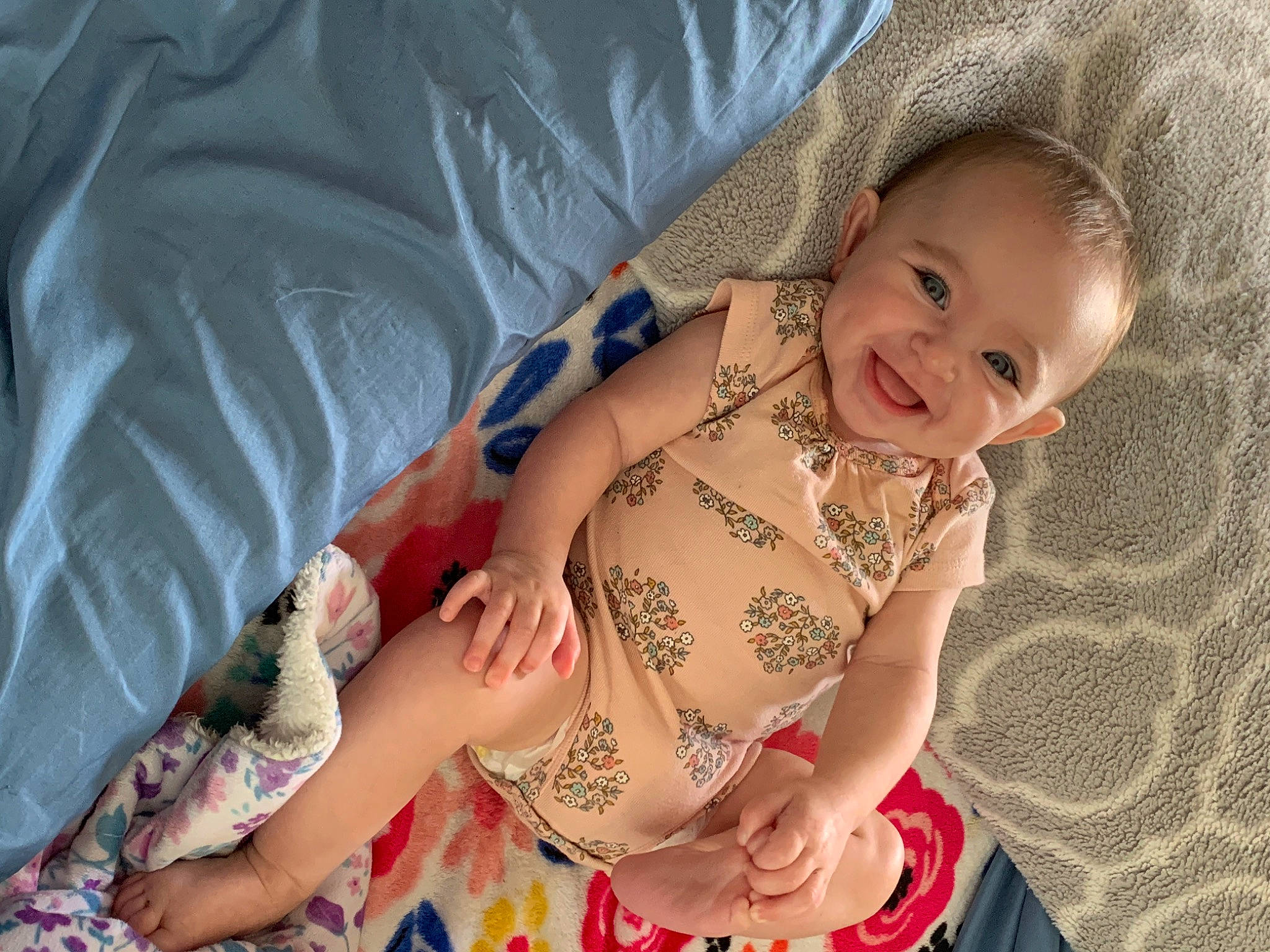 Ava Grace is registered to the contest to win money with this photo: baby, baby_toddler_clothing, cheek, chest, comfort, dress, eye, face, hand, happy, head, human_body, iris, joy, mouth, person, pink, skin, smile, textile