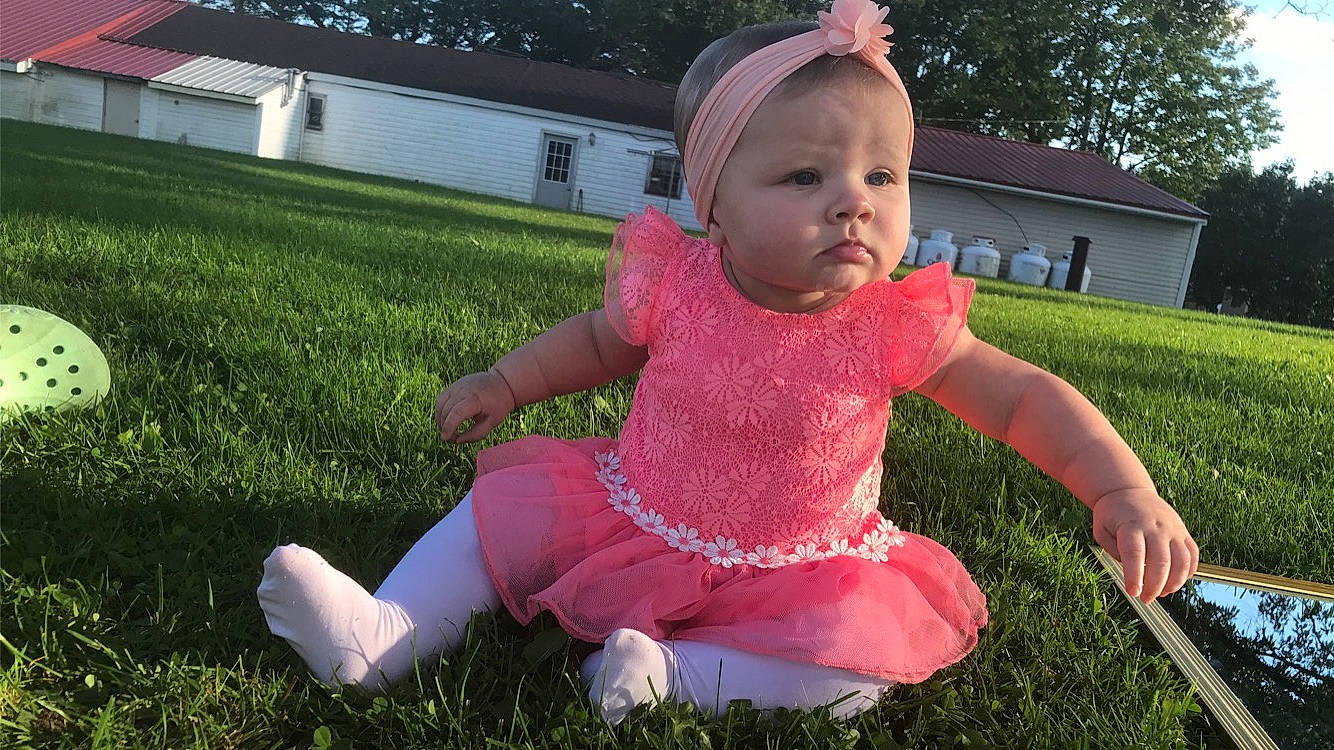 Amarah is registered to the contest to win money with this photo: baby, baby_toddler_clothing, child, computer_keyboard, dress, finger, fun, grass, happy, lawn, leisure, people_in_nature, person, pink, plant, recreation, sleeve, summer, toddler, tree