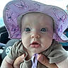 baby, infant, child, hat, purple, butterfly, onesie, clothing, face, eyes, hand, car, car_interior, person, cute, portrait, closeup, expression, skin, holding