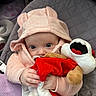 baby, blue_eyes, child, clothing, cozy, curious, cute, face, hand, hoodie, indoor, infant, pink_clothing, plush_toy, portrait, quilted, seat, soft_toy, stuffed_animal, warm