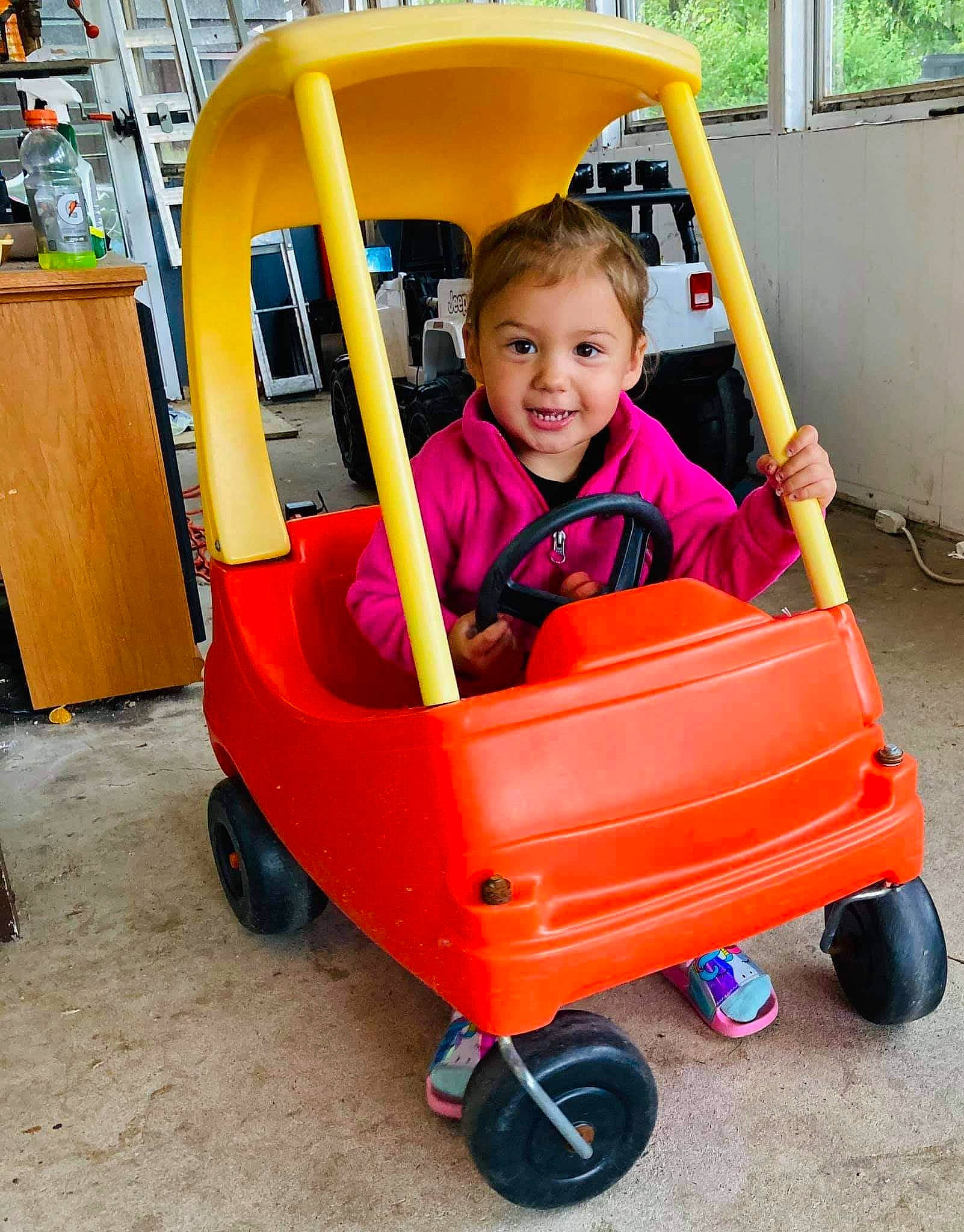 Isabelle joined the competition — help win amazing prizes! baby_products, child, person, play, product, riding_toy, toddler, vehicle, yellow