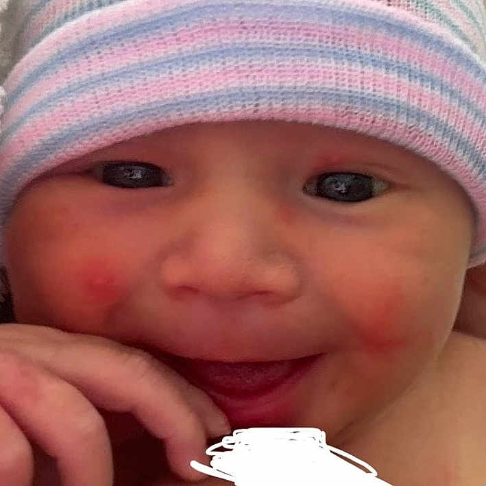Valor joined the competition — help win amazing prizes! baby, baseballcap, beanie, bodypart, bonnet, cap, clothing, face, finger, hand, happy, hat, head, laughing, mouth, newborn, person, photography, portrait, smile