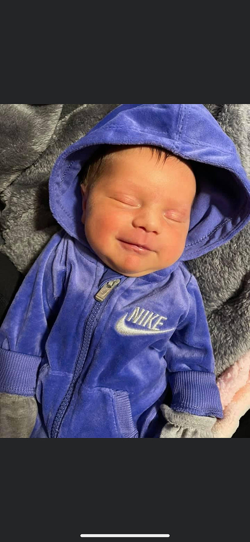 Brittany is registered to the contest to win money with this photo: baby, baby_toddler_clothing, cap, cheek, chin, clothing, comfort, cool, eye, eyebrow, head, jacket, mouth, outerwear, person, purple, sleeve, smile, textile, toddler