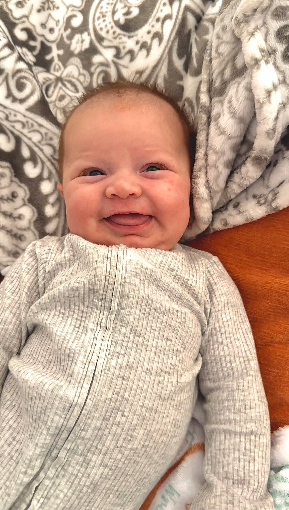 Wrenley is registered to the contest to win money with this photo: baby, baby_toddler_clothing, cheek, chin, collar, comfort, eye, face, happy, head, iris, joy, lip, nose, pattern, person, product, skin, sleeve, smile