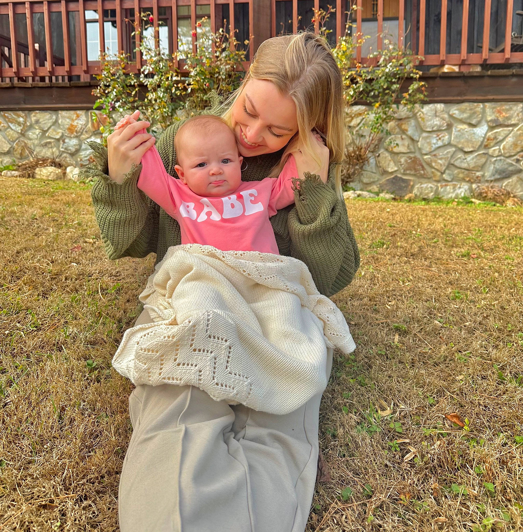 Wrenley is registered to the contest to win money with this photo: autumn, baby, baby_products, baby_toddler_clothing, child, face, fun, garden, gesture, grass, happy, head, joy, lawn, leisure, people_in_nature, person, plant, sitting, toddler
