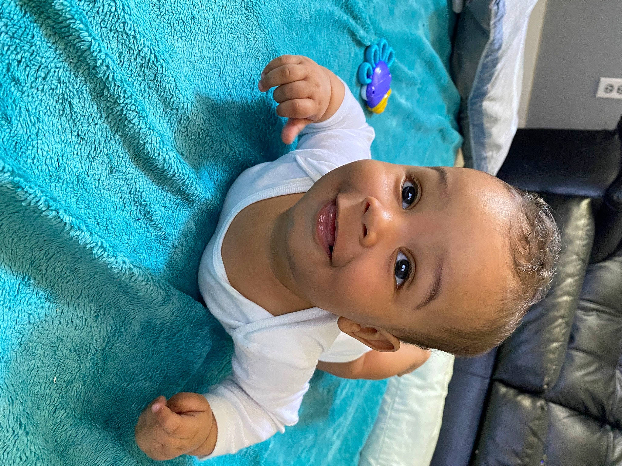Dequan Jr is registered to the contest to win money with this photo: azure, baby, baby_toddler_clothing, blue, child, comfort, electric_blue, eyebrow, fun, hand, happy, hat, joy, linens, mouth, nose, person, room, skin, sleeve