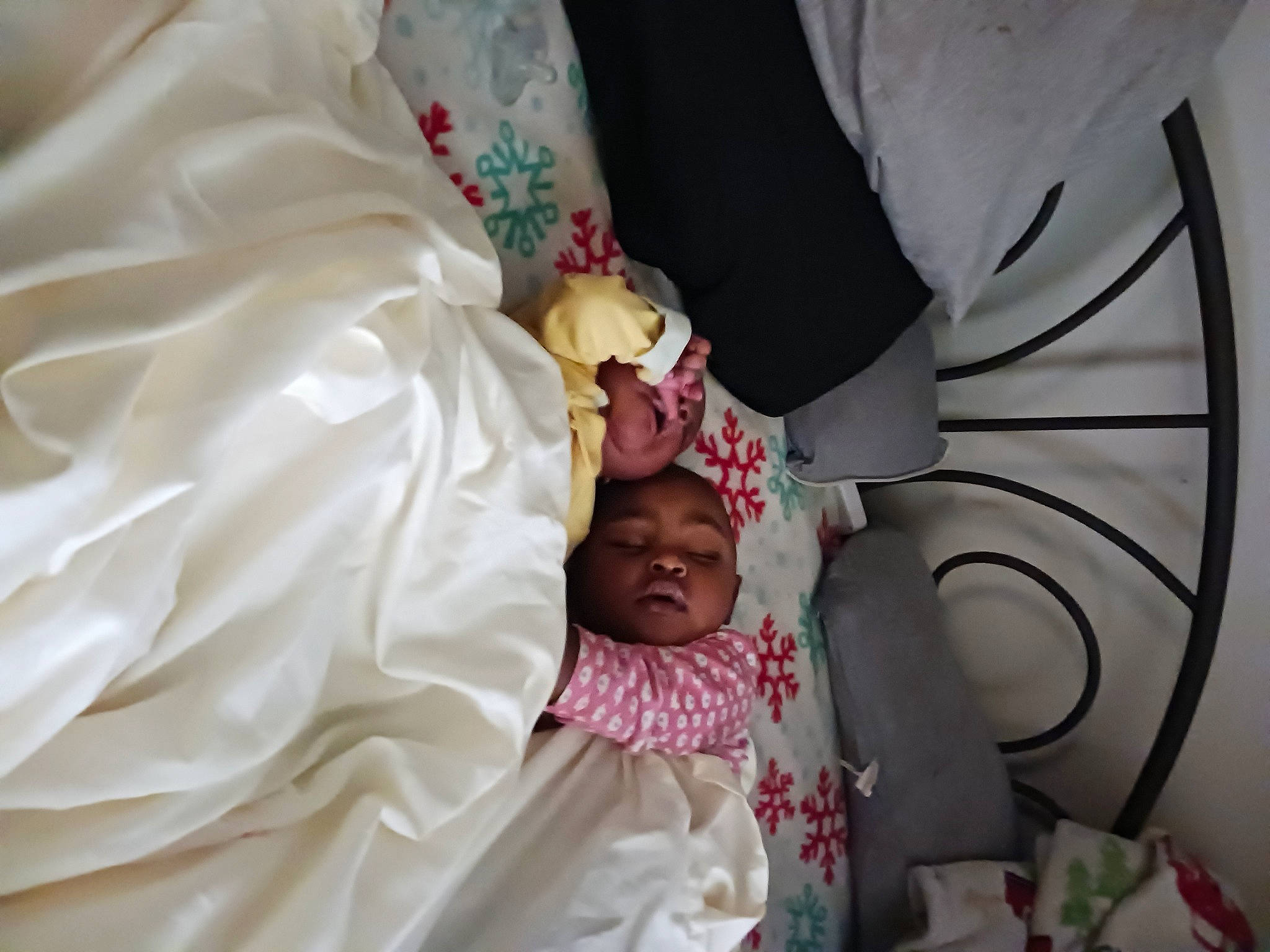 Kalaiyaa is registered to the contest to win money with this photo: baby, baby_products, baby_toddler_clothing, bed, bed_sheet, bedding, bedtime, child, comfort, event, hand, hat, head, headwear, linens, magenta, peach, person, room, toddler