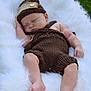 Maxim joined the competition — help win amazing prizes! baby, sleeping, knitted_clothing, brown_outfit, hat, fluffy_blanket, white_fur, outdoor, grass, infant, cute, peaceful, soft_texture, relaxation, portrait, child, legs, barefoot, head, hand