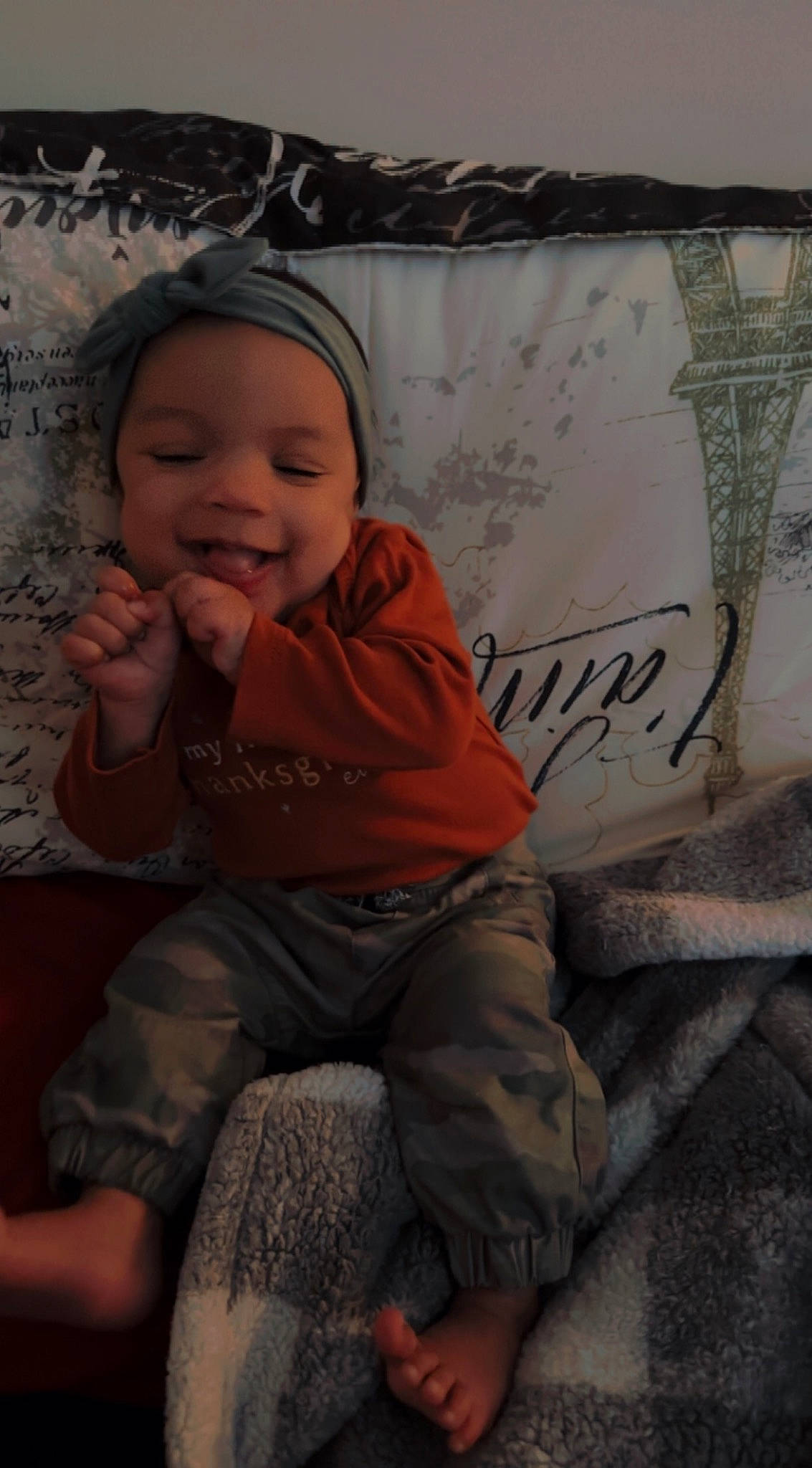 Royalty is registered to the contest to win money with this photo: baby, baby_toddler_clothing, cheek, child, comfort, eye, facial_expression, foot, fun, grass, happy, head, headwear, human_leg, joy, lap, mouth, person, shorts, sitting