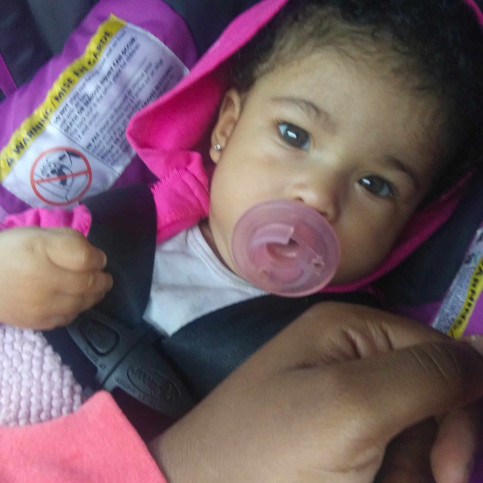 Kyanna is registered to the contest to win money with this photo: black_hair, cheek, child, chin, day, ear, face, finger, forehead, hand, head, infant, lip, mouth, nose, person, pink, product, purple, skin