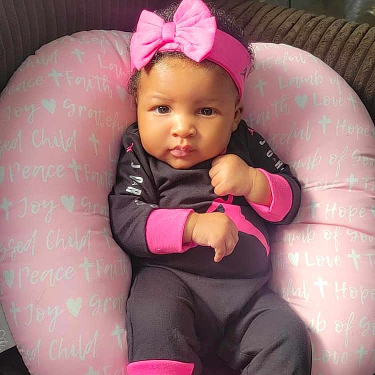 Iselyn joined the competition — help win amazing prizes! baby, clothing, coat, couch, cushion, face, footwear, furniture, hat, head, homedecor, hosiery, jacket, pants, person, photography, portrait, purple, shoe, sitting