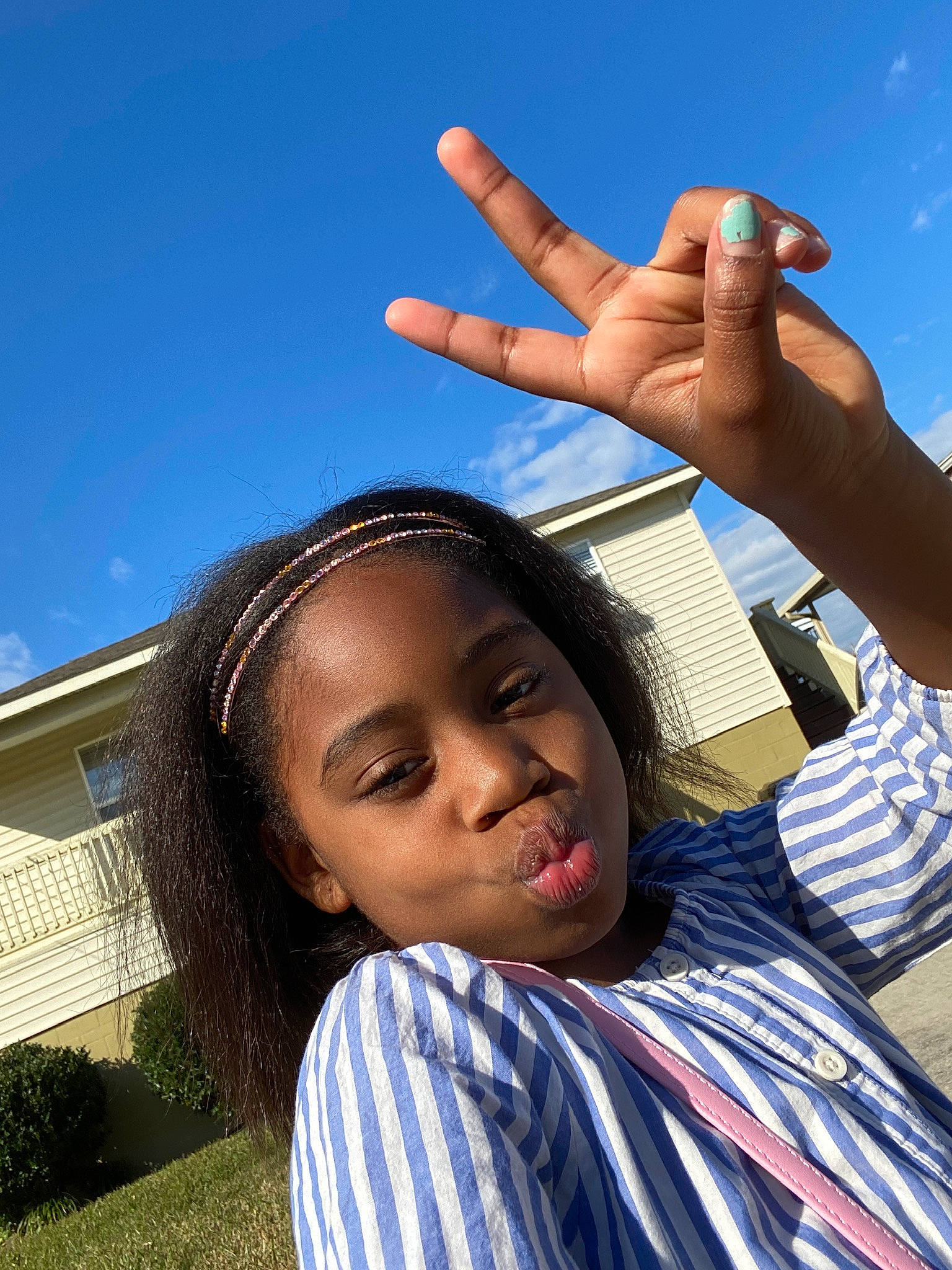 Zylajh Lavigne joined the competition — help win amazing prizes! black_hair, blue, child, finger, fun, gesture, hand, happy, leisure, person, photography, sky, smile, sunlight, thumb, tourism, v_sign, vacation