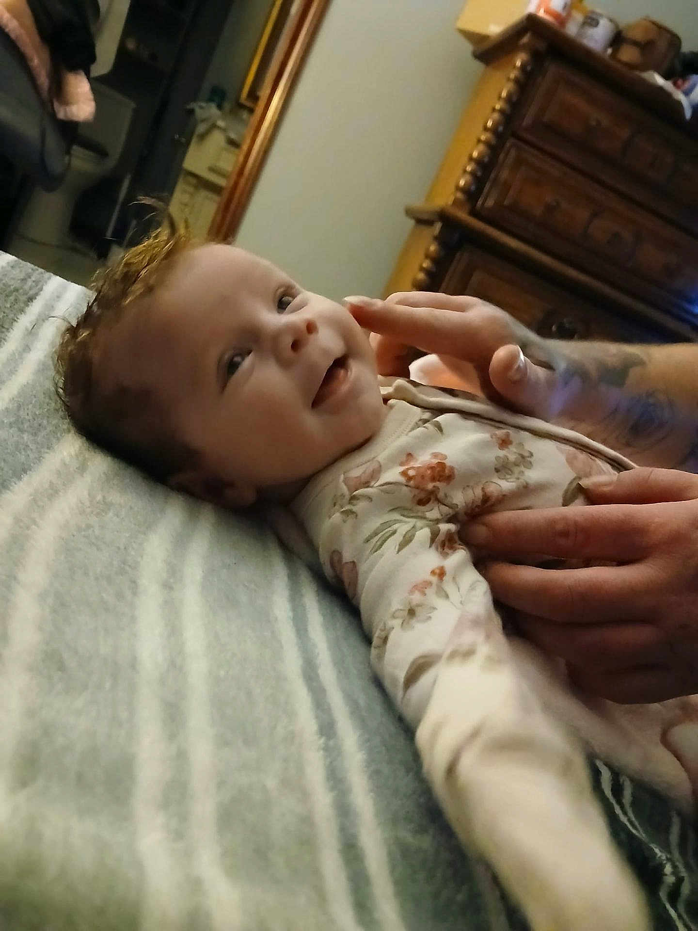 Starrlynn joined the competition — help win amazing prizes! baby, smiling, hands, tattoo, blanket, striped, bedroom, furniture, drawer, wood, cozy, infant, clothing, floral, cute, portrait, child, happy, person, soft