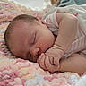 Zoey is registered to the contest to win money with this photo: baby, bed, blanket, close_up, cozy, curled_up, cute, face, hands, indoors, infant, newborn, onesie, pastel, peaceful, pink, portrait, sleeping, soft, white