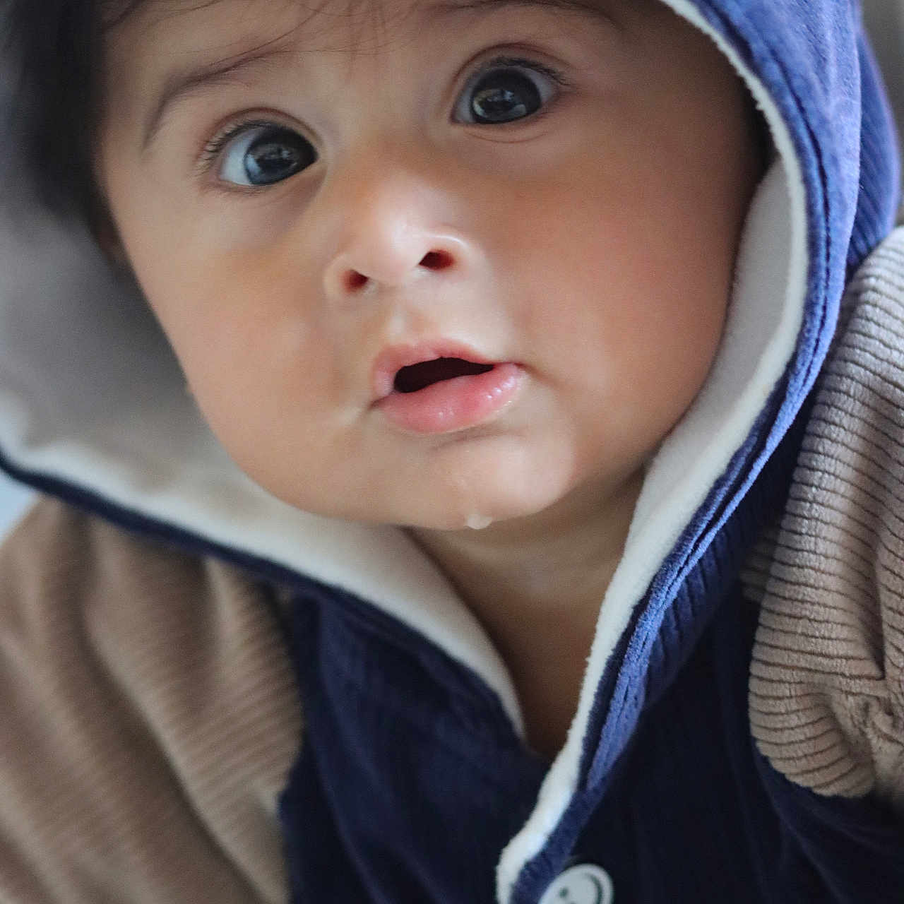 Aayansh is registered to the contest to win money with this photo: baby, beanie, bonnet, cap, clothing, coat, face, fleece, hat, head, hood, hoodie, jacket, knitwear, person, photography, portrait, sunhat, sweater, sweatshirt