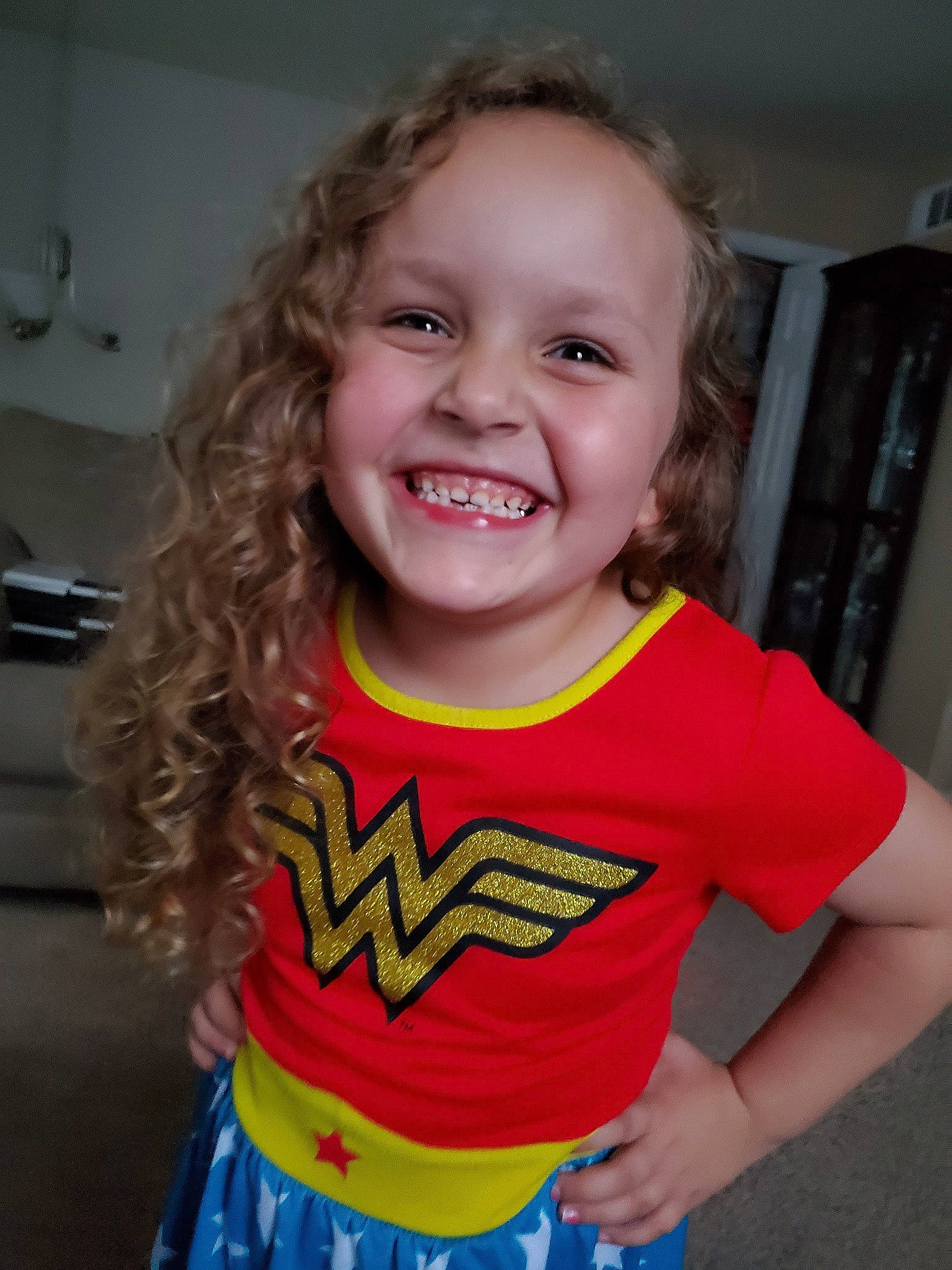 Ashlyn joined the competition — help win amazing prizes! arm, child, face, facial_expression, fictional_character, fun, happy, head, joy, justice_league, laugh, mouth, organ, person, sleeve, smile, standing, superhero, superman, t_shirt