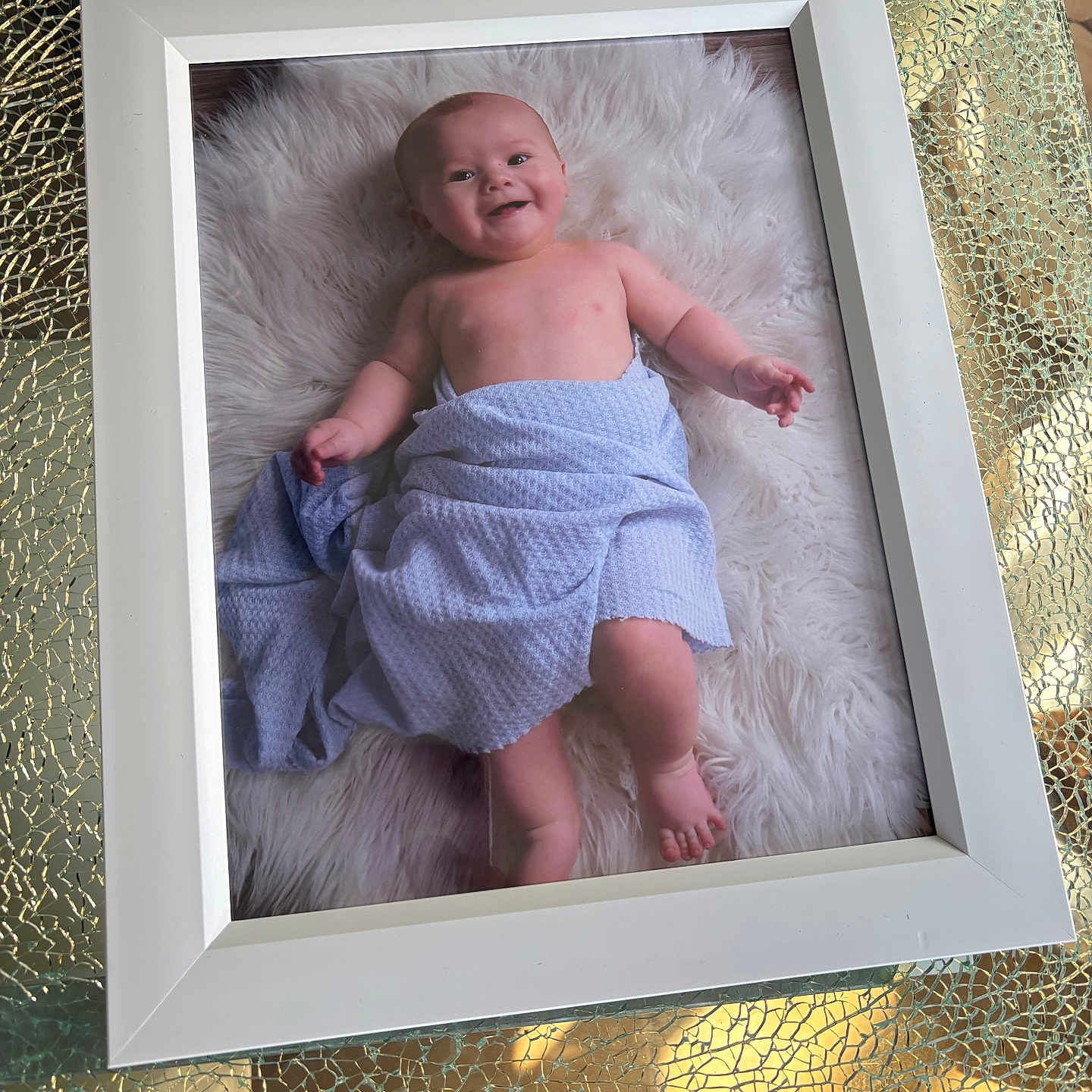 Maximo joined the competition — help win amazing prizes! baby, bare_chest, child, cute, decor, fluffy_rug, glass_table, happy, indoor, infant, lying_down, photograph, portrait, reflection, skin, smile, table, texture, towel, white_frame