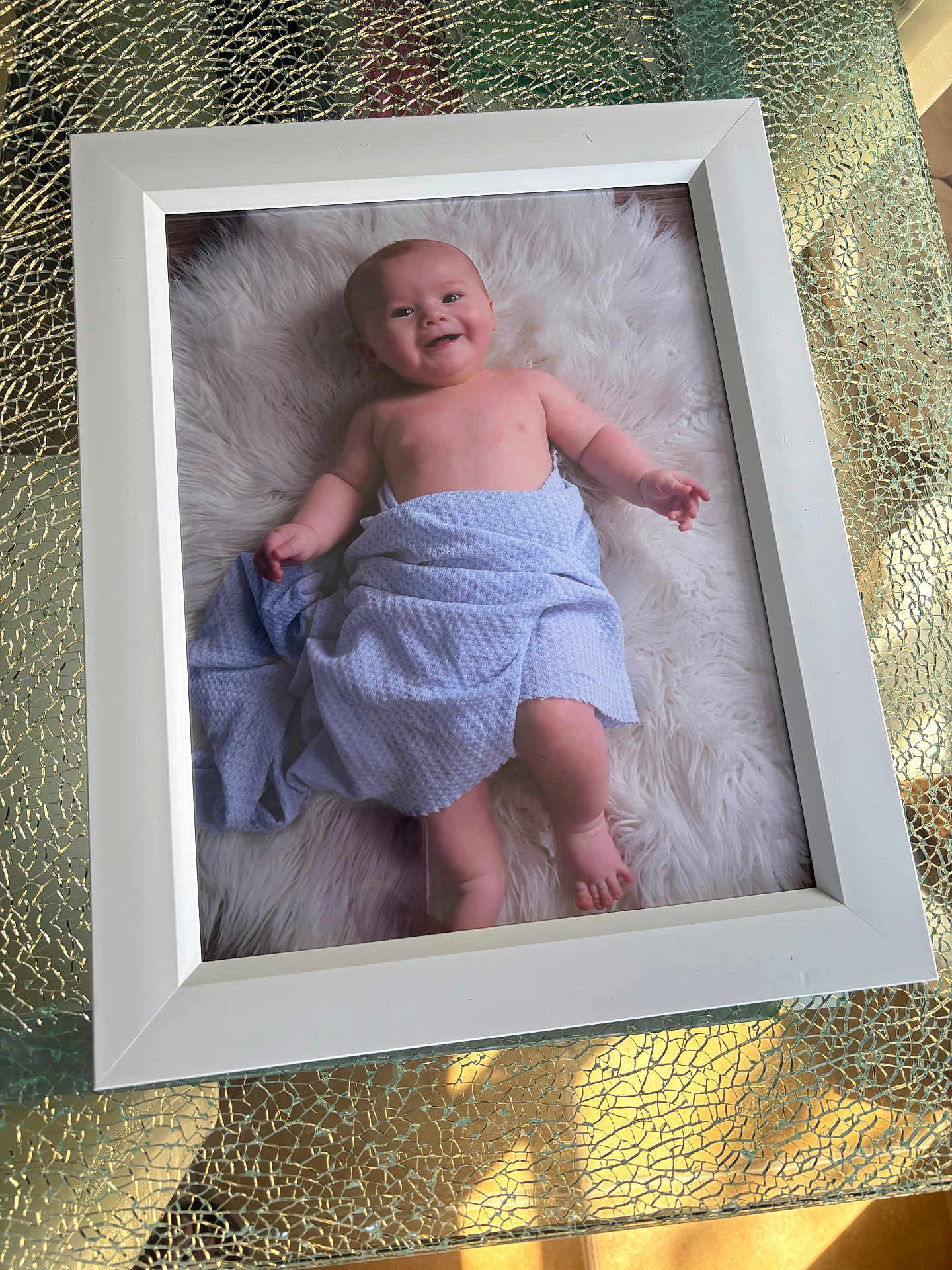 Maximo joined the competition — help win amazing prizes! baby, towel, white_frame, fluffy_rug, smile, infant, portrait, child, table, glass_table, texture, reflection, indoor, cute, skin, bare_chest, happy, lying_down, photograph, decor