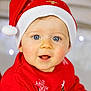 baby, blue_eyes, child, christmas, christmas_hat, closeup, cute, face, festive, happy, holiday, holiday_lights, indoor, portrait, red_sweater, rosy_cheeks, santa_hat, seasonal, smiling, young_child