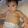 baby, back, bodypart, couch, diaper, face, finger, furniture, hand, head, newborn, person, sitting