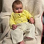 baby, infant, yellow_sweater, cream_pants, blanket, soft_texture, smile, cute, indoor, portrait, child, happy, cozy, sitting, feet, hand, face, clothing, warm, relaxed