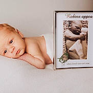 Ezra joined the competition — help win amazing prizes! newborn, baby, infant, portrait, sleeping, soft, blanket, white, frame, photograph, bird, peaceful, cute, closeup, face, skin, resting, child, indoors, lying_down