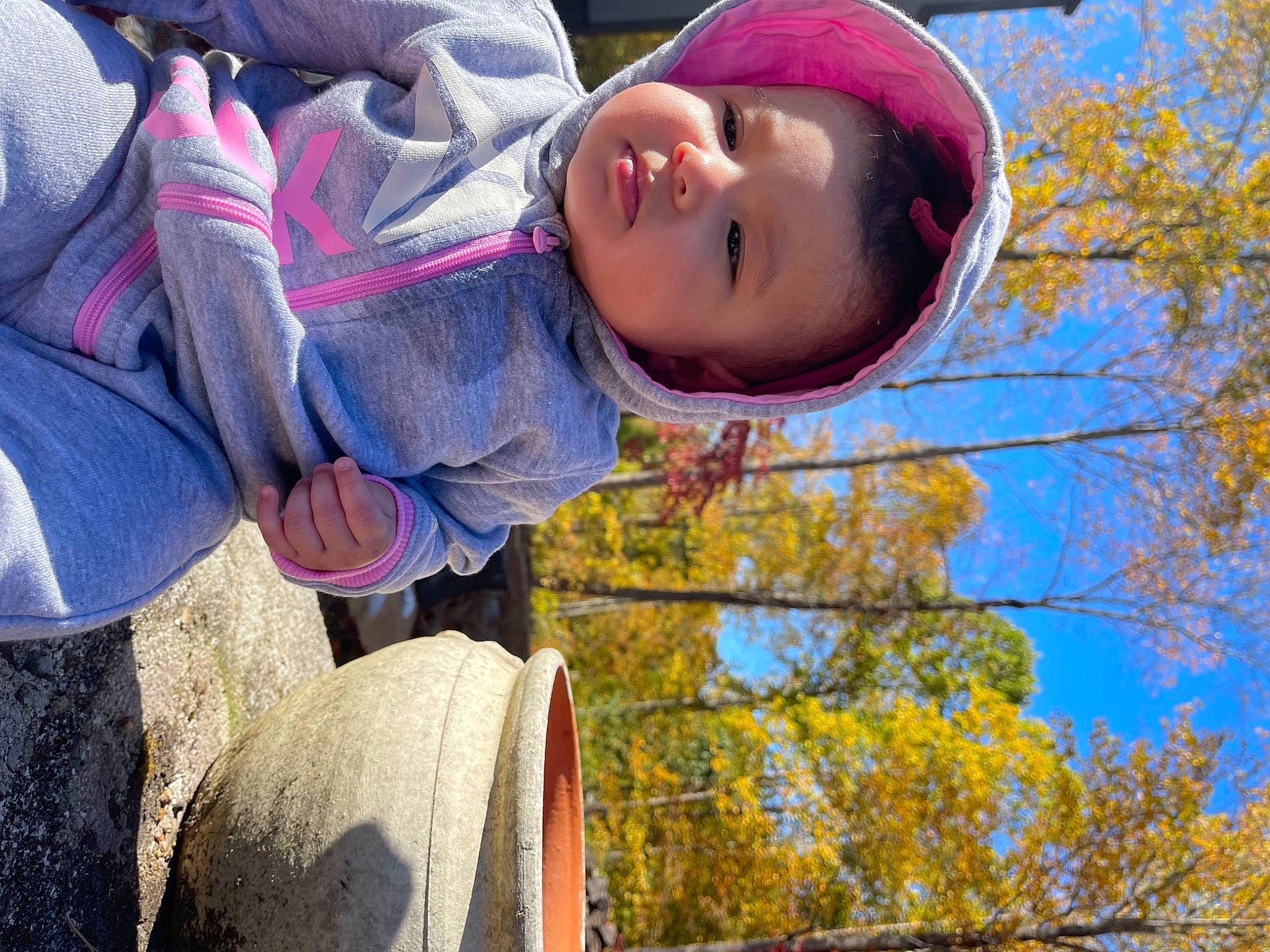Ellie is registered to the contest to win money with this photo: beauty, child, face, fun, grass, happy, hat, jacket, leisure, magenta, people, people_in_nature, person, pink, plant, recreation, sky, smile, toddler, tree