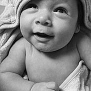 Maximilian joined the competition — help win amazing prizes! adorable, baby, black_and_white, blanket, child, close_up, cozy, eyes, face, happy, hood, indoor, infant, monochrome, photography, portrait, sitting, smiling, soft_lighting, wrapped