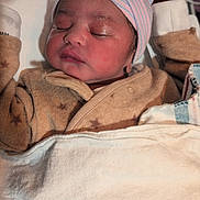 Preston is registered to the contest to win money with this photo: newborn, baby, sleeping, hat, blanket, hospital, incubator, pajamas, infant, child, cozy, cute, face, person, bed, soft, warm, resting, healthcare, closeup