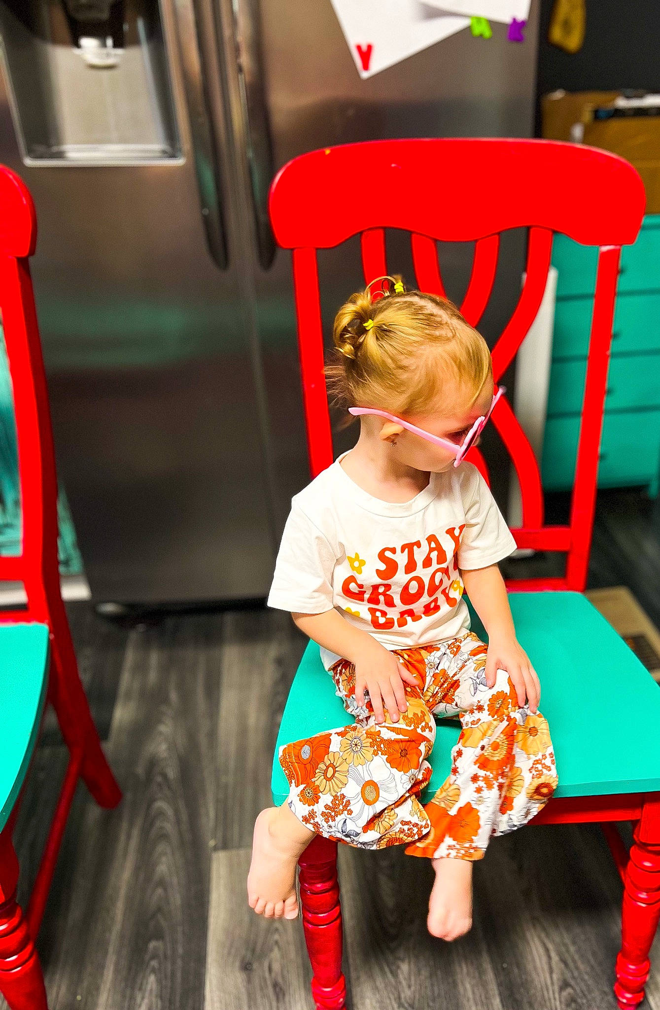 Oaklynn joined the competition — help win amazing prizes! baby_toddler_clothing, chair, child, event, fun, green, happy, human_leg, leisure, magenta, person, pink, play, red, sandal, sitting, sleeve, sock, standing, t_shirt