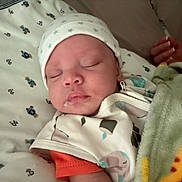 Honest joined the competition — help win amazing prizes! baby, sleeping, hat, blanket, bed, teddy_bear_pattern, clothing, hand, nail_polish, face, infant, closeup, rest, soft_toys, pajamas, indoor, cute, peaceful, newborn, cozy