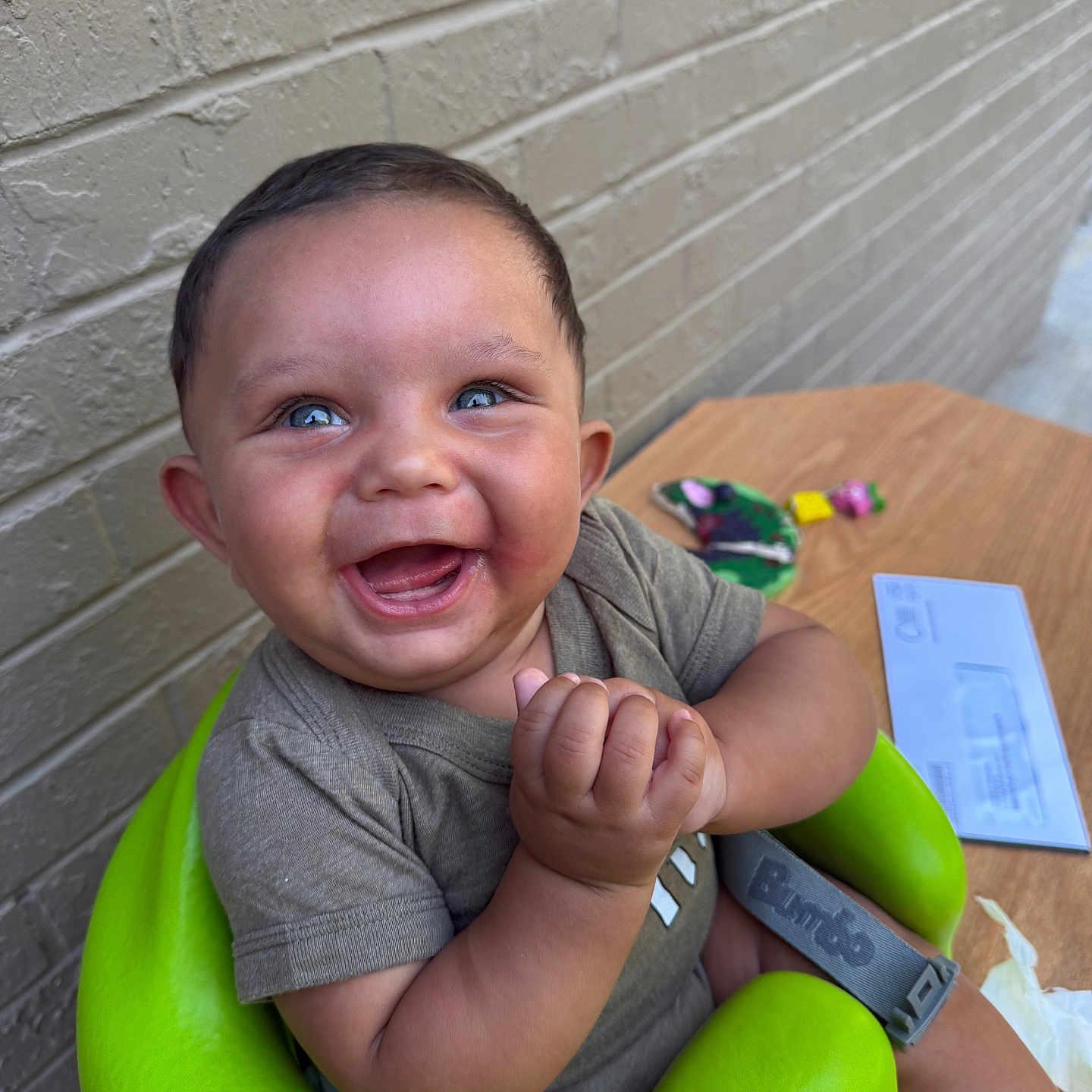 Deangelo joined the competition — help win amazing prizes! baby, blue_eyes, brick_wall, child, clapping_hands, clothing, cute, green_seat, happy, indoor, infant, joyful, letter, person, portrait, seat, short_sleeve_shirt, smiling, toys, wooden_table