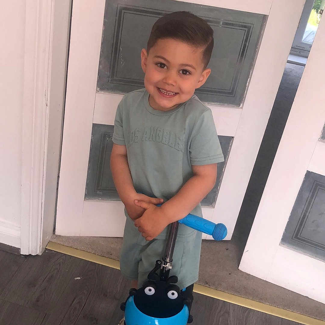 Ontario joined the competition — help win amazing prizes! blue, boy, child, clothing, door, floor, handlebar, happy, home, indoor, person, playful, scooter, shorts, smiling, toy, tshirt, vehicle, wooden_floor, young_child