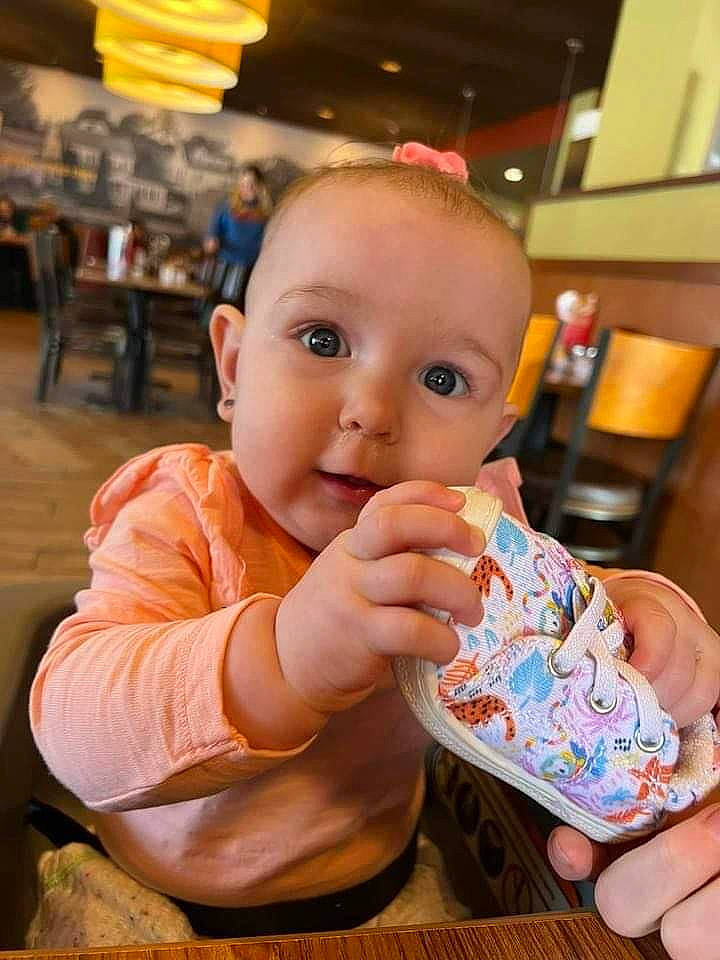 Brynlee is registered to the contest to win money with this photo: baby, baby_toddler_clothing, chair, cheek, child, drinkware, finger, flooring, fun, hand, happy, iris, lighting, nail, nose, orange, person, sitting, thumb, toddler
