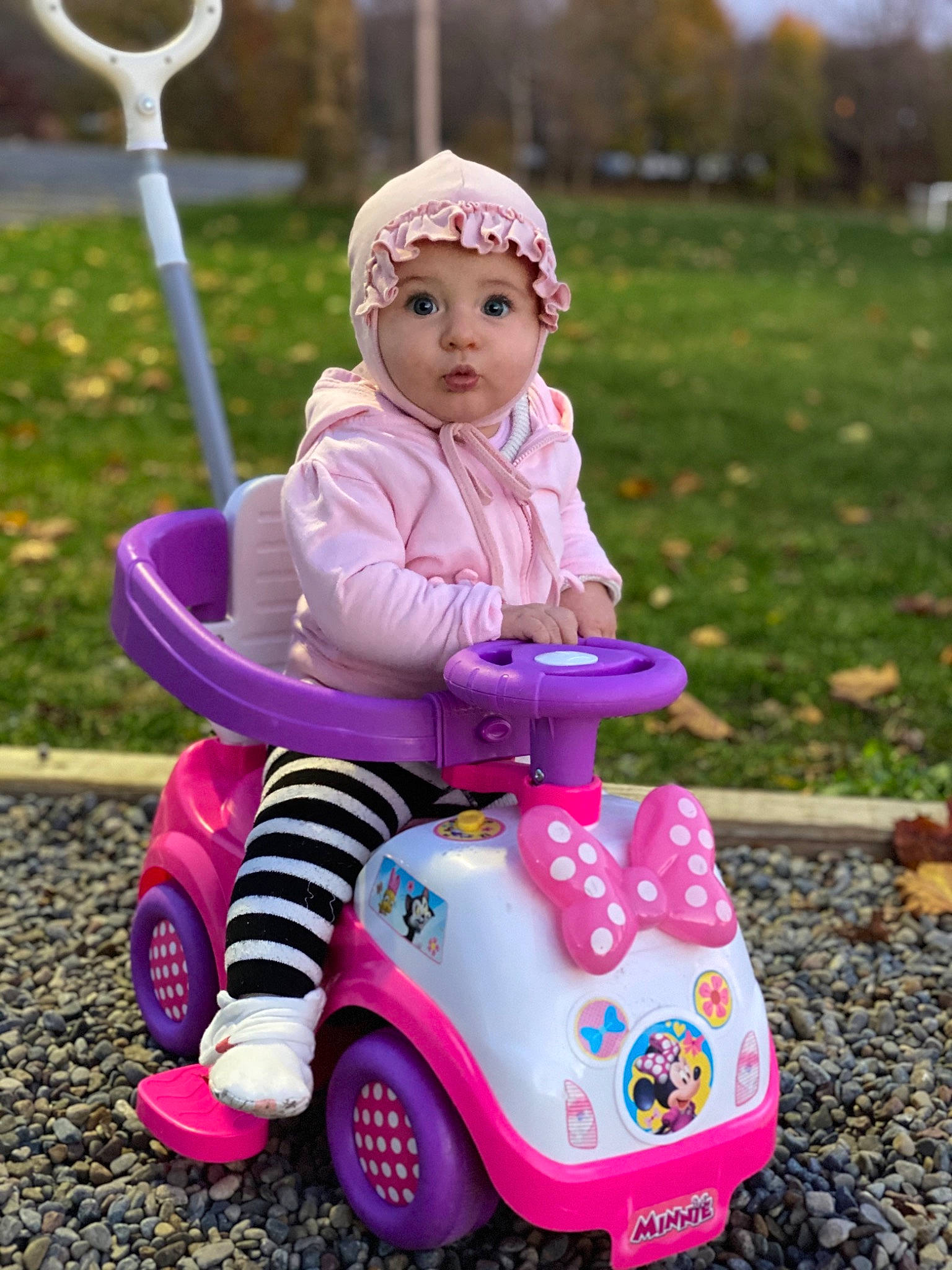 Alisa joined the competition — help win amazing prizes! baby_toddler_clothing, face, fun, grass, happy, headwear, leisure, light, magenta, person, photograph, pink, product, purple, recreation, riding_toy, surprise, tire, toddler, toy