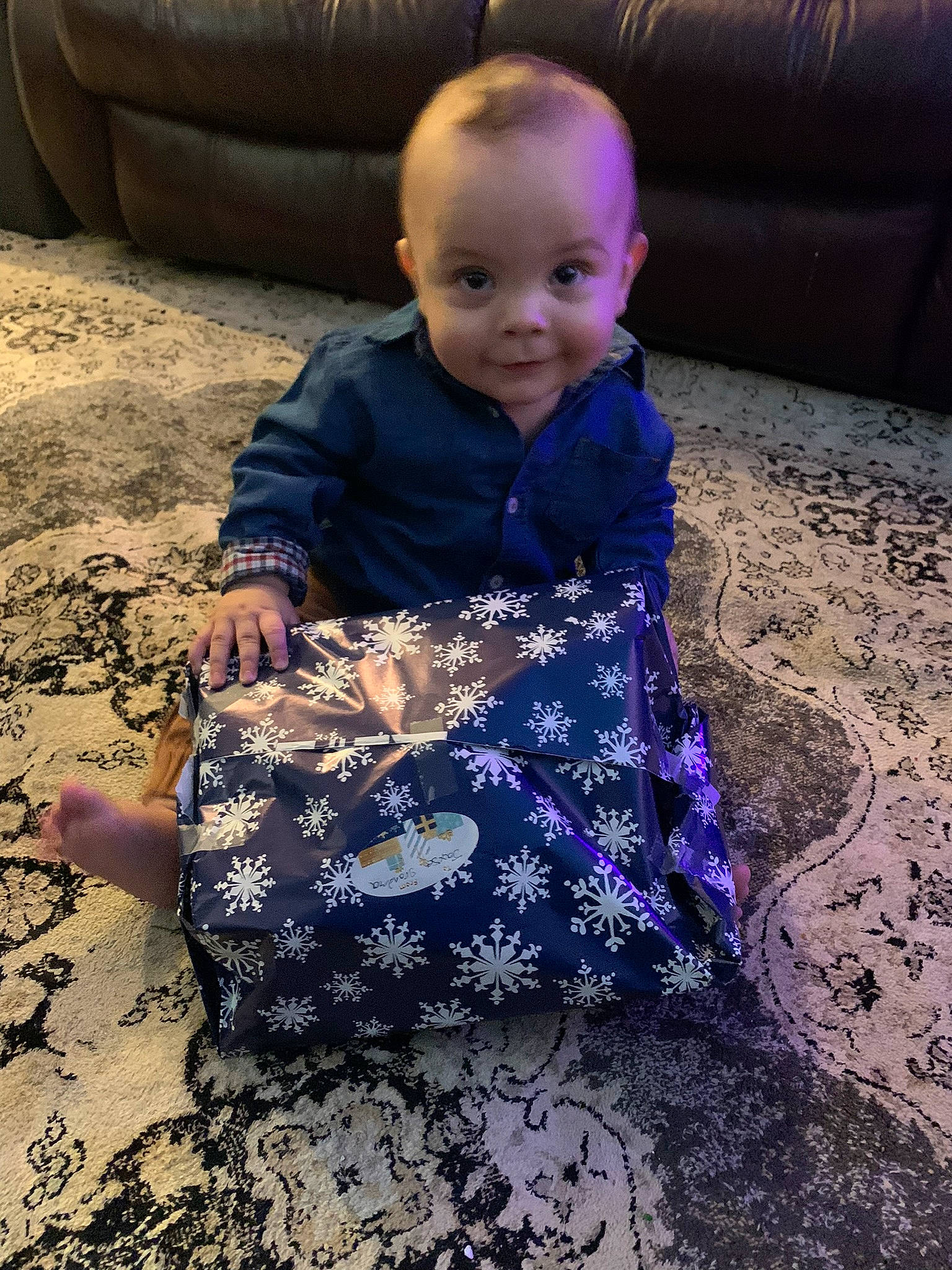 Jaxon is registered to the contest to win money with this photo: baby, baby_toddler_clothing, child, comfort, couch, electric_blue, face, flooring, fun, happy, head, magenta, pattern, person, purple, sitting, sleeve, smile, t_shirt, toddler